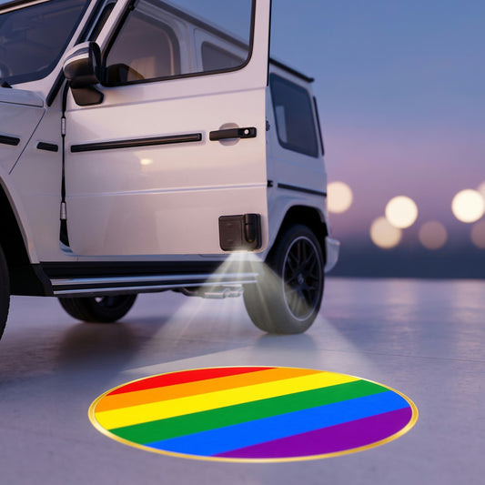 PRIDEMARK projecting the rainbow flag onto the ground under an open car door